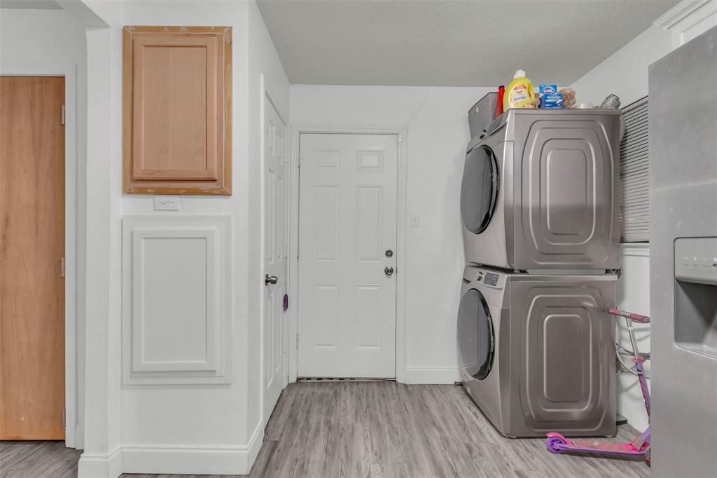 929 North Hall Street Lancaster, TX 75146 - Photo 11 of 24 a view of walk in closet with clothes and shoes