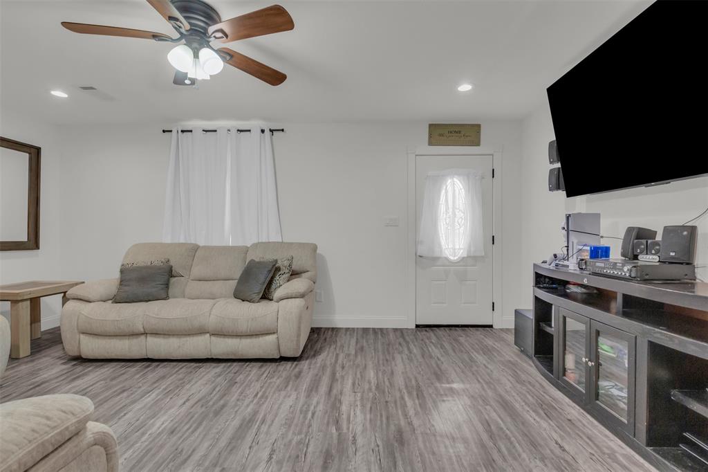 929 North Hall Street Lancaster, TX 75146 - Photo 7 of 24 a living room with furniture and a flat screen tv