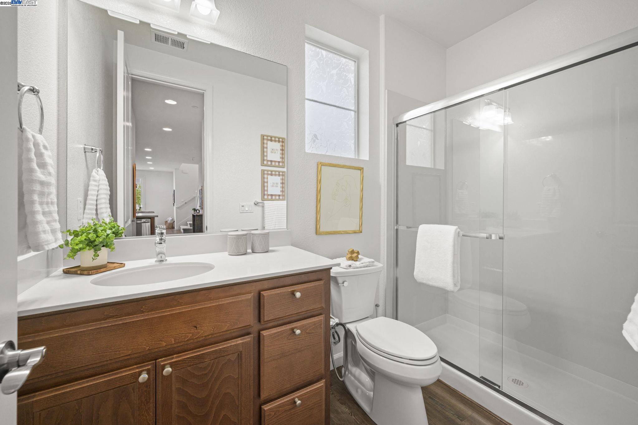 2336 Carbondale Way Dublin, CA 94568 - Photo 30 of 54 a bathroom with a sink a toilet and shower