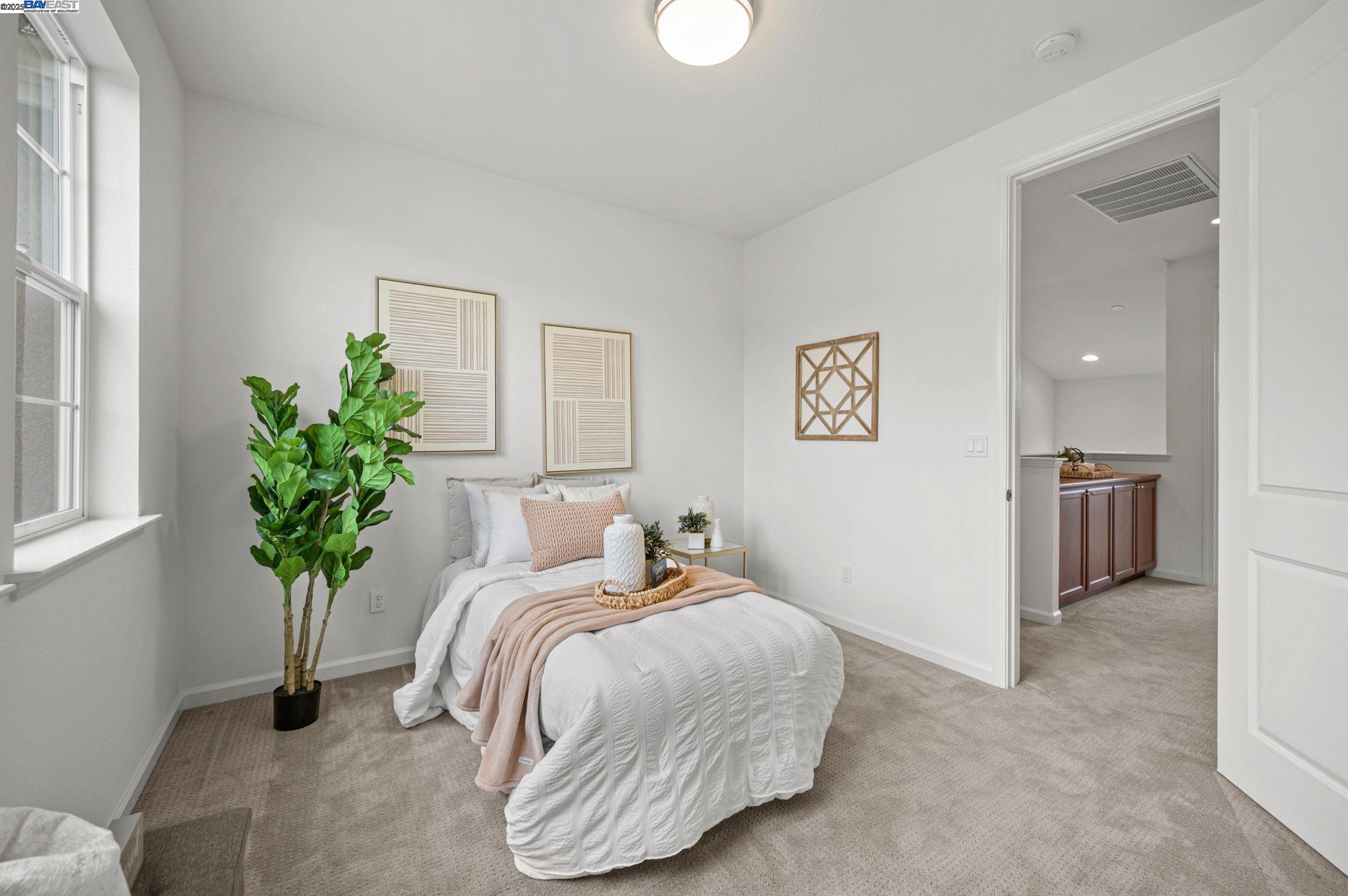 2336 Carbondale Way Dublin, CA 94568 - Photo 44 of 54 a bedroom with a bed and a potted plant