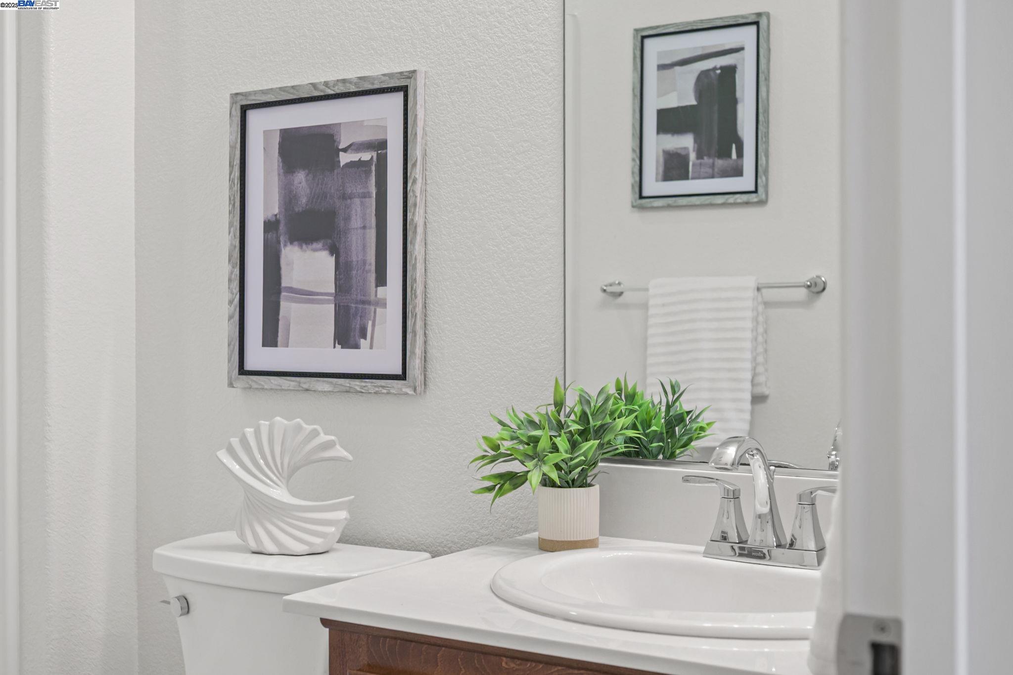 2336 Carbondale Way Dublin, CA 94568 - Photo 9 of 54 a bathroom with a toilet a sink and mirror