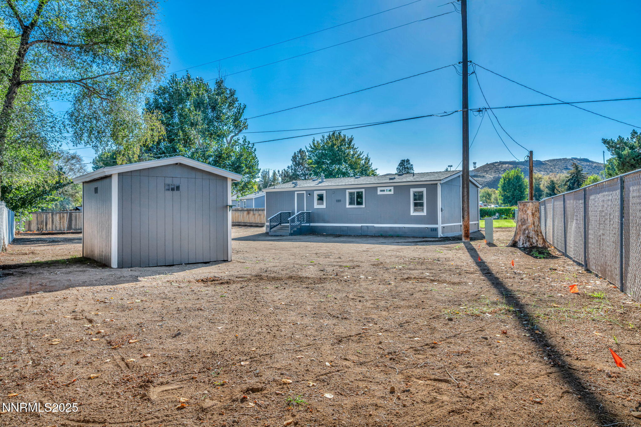 415 Vagabond Court Reno, NV 89506 - Photo 12 of 46 a view of a house with a yard and potted plants