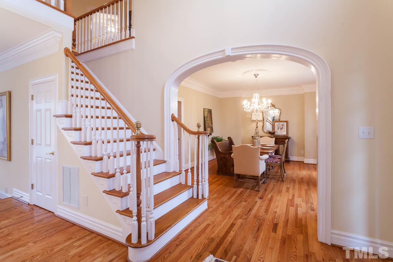 12420 Bayleaf Church Road Raleigh, NC 27614 - Photo 14 of 25 a view of a hallway with wooden floor and staircase