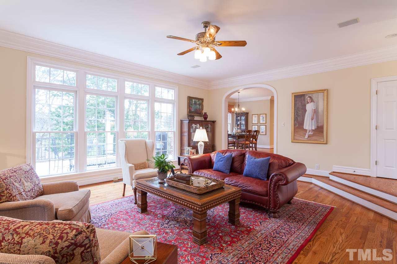 12420 Bayleaf Church Road Raleigh, NC 27614 - Photo 8 of 25 a living room with furniture a table and a large window