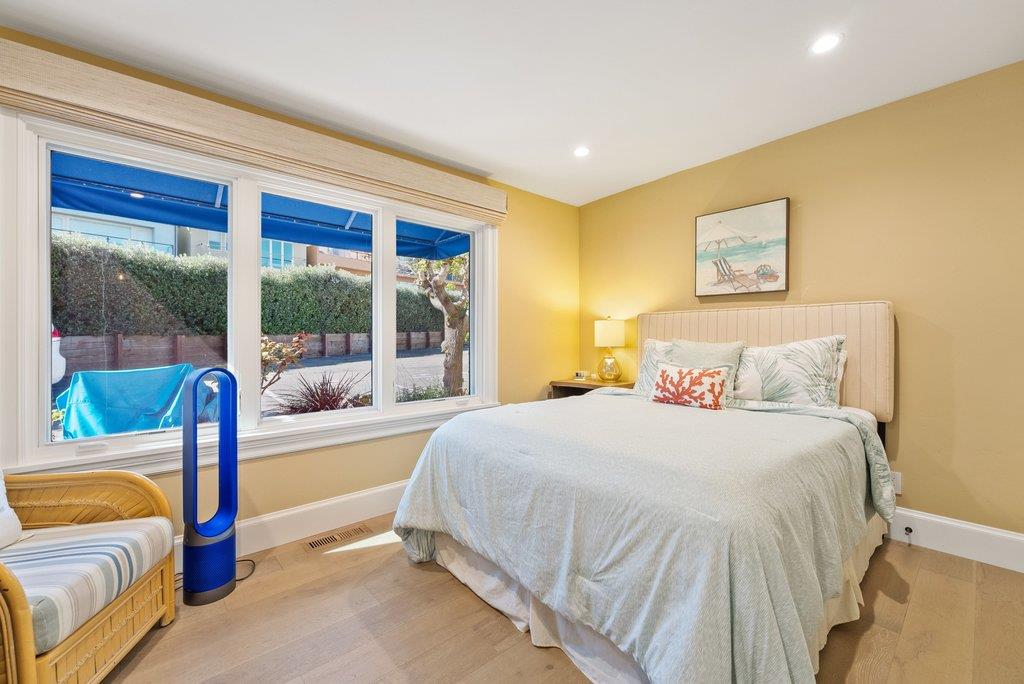 1500 Wharf Road, Unit 22 Capitola, CA 95010 - Photo 28 of 48 a bedroom with a bed and a couch