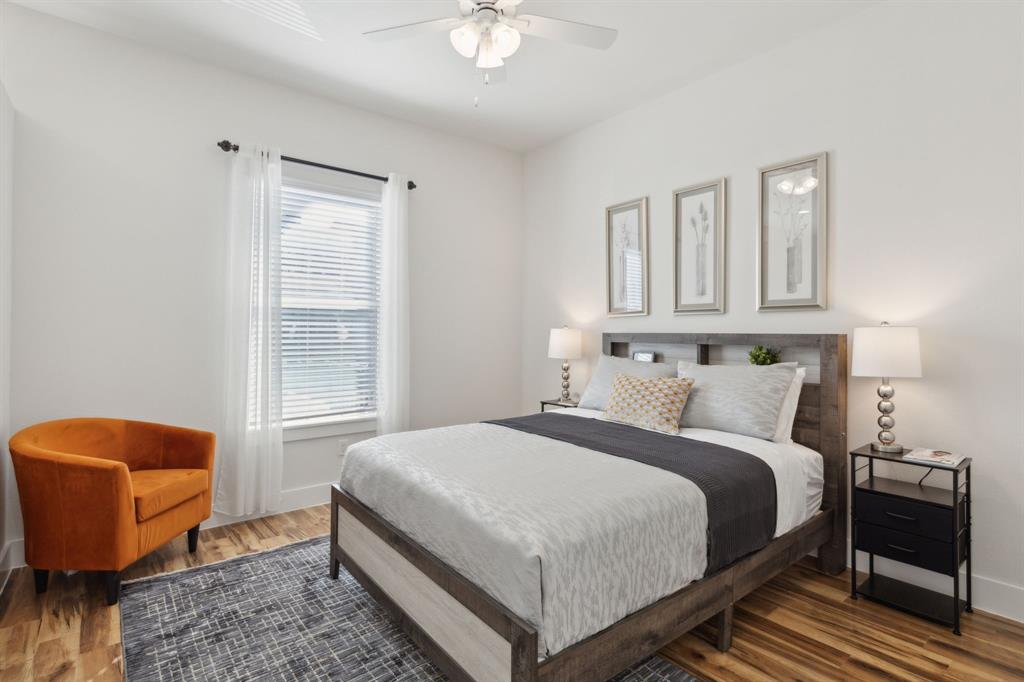 2990 Reagan Street Dallas, TX 75219 - Photo 12 of 20 a bedroom with a bed and window