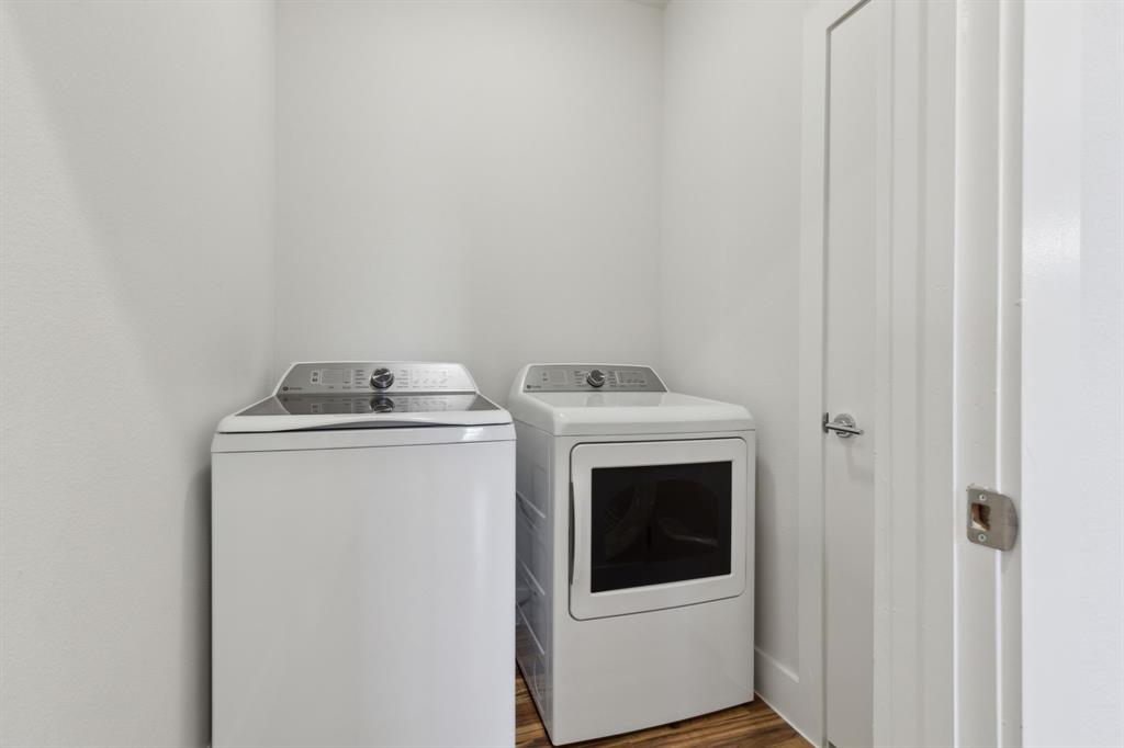 2990 Reagan Street Dallas, TX 75219 - Photo 13 of 20 a utility room with dryer and washer