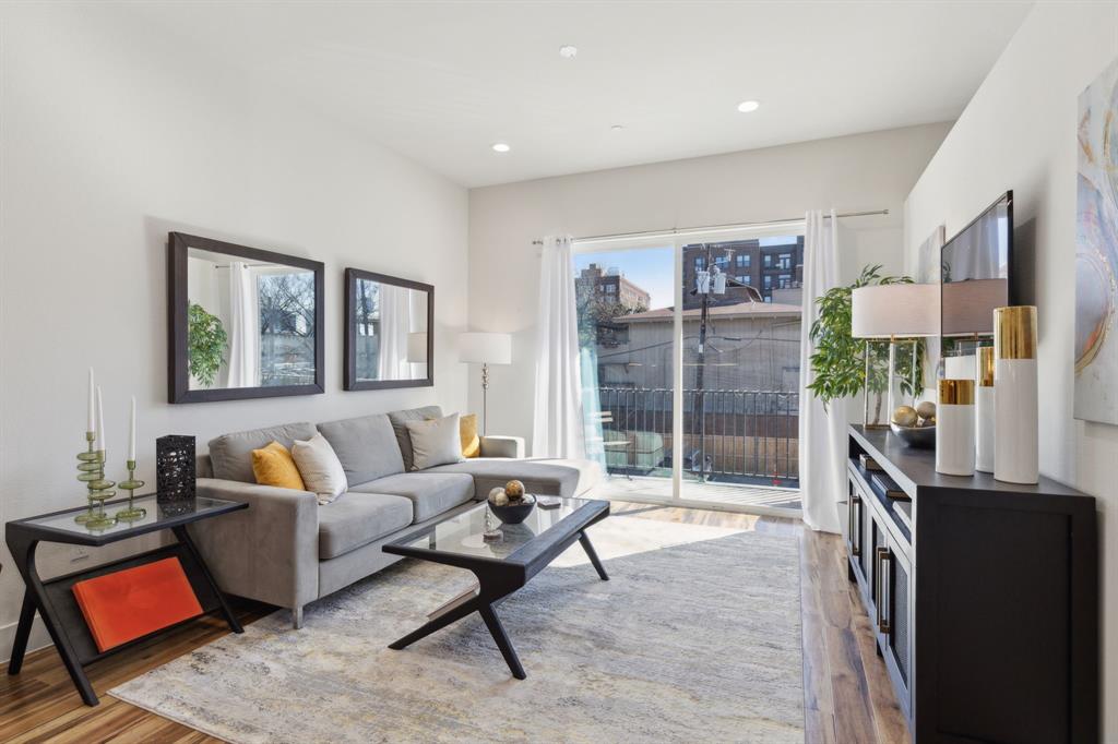 2990 Reagan Street Dallas, TX 75219 - Photo 3 of 20 a living room with furniture and a flat screen tv