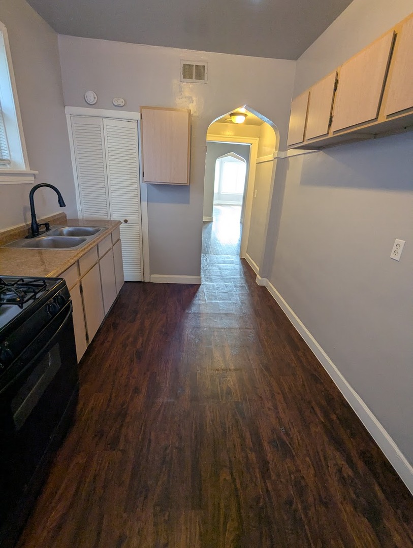 7545 South May Street Chicago, IL 60620 - Photo 16 of 18 a view of a kitchen from a sink