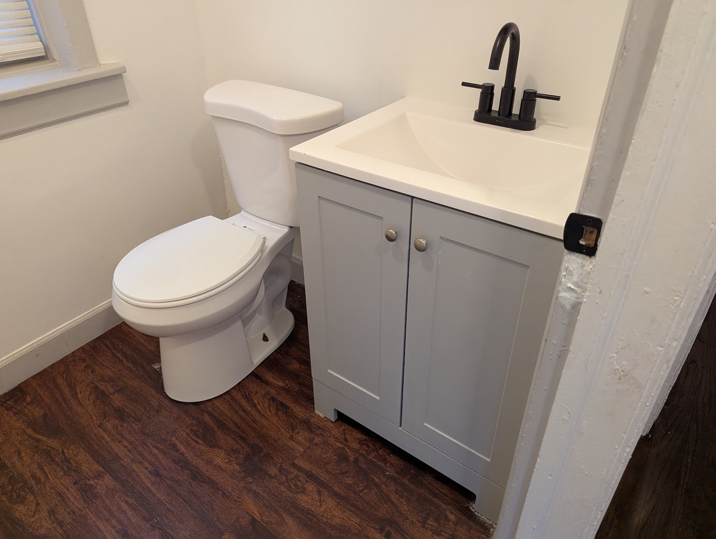 7545 South May Street Chicago, IL 60620 - Photo 7 of 18 a bathroom with a toilet and a sink