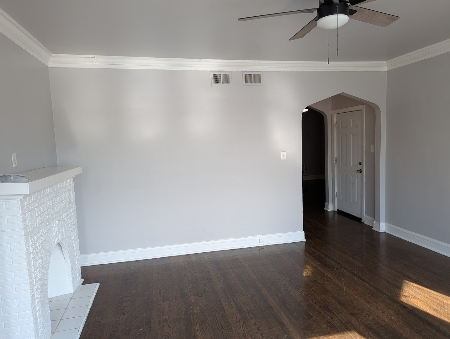 7545 South May Street Chicago, IL 60620 - Photo 8 of 18 a view of an empty room with wooden floor