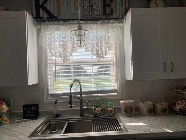 a kitchen with a sink and a window