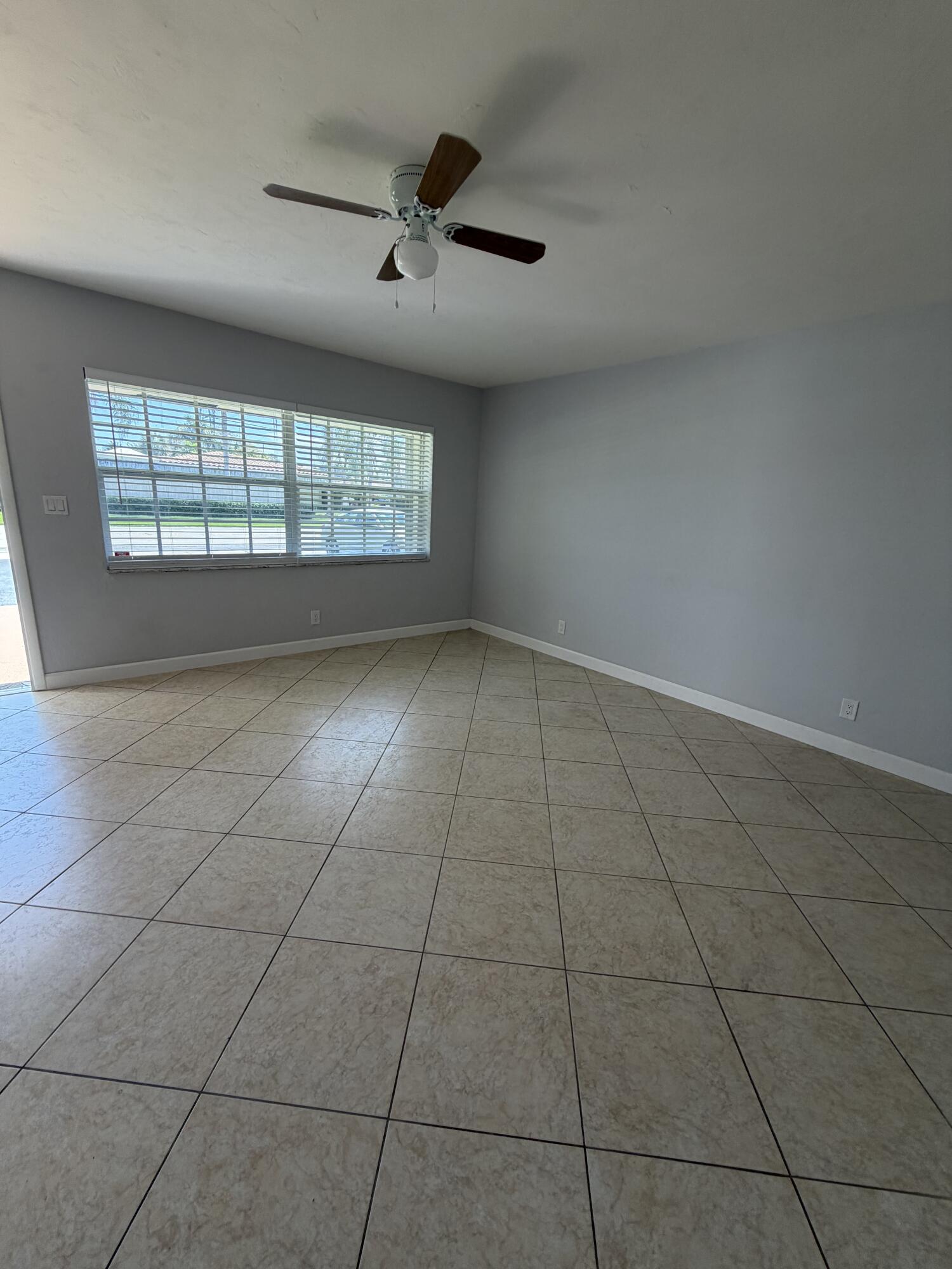 3225 Northeast 21st Avenue, Unit 7 Lighthouse Point, FL 33064 - Photo 12 of 28 a view of an empty room with a window