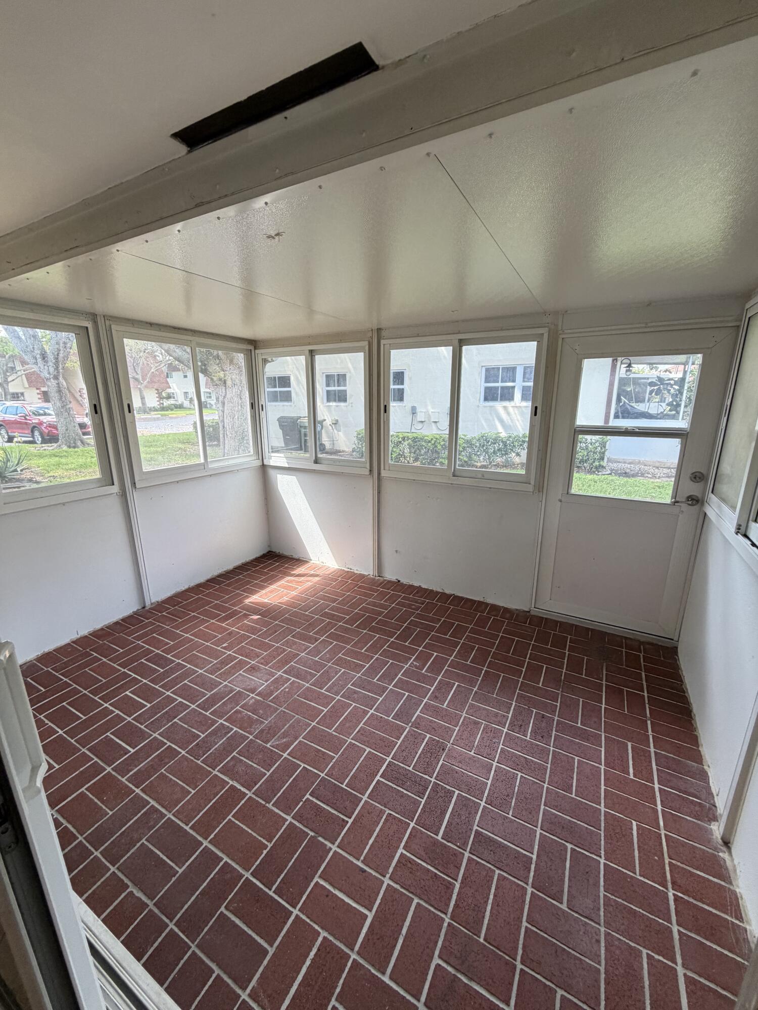 3225 Northeast 21st Avenue, Unit 7 Lighthouse Point, FL 33064 - Photo 16 of 28 a bedroom with a bed and window