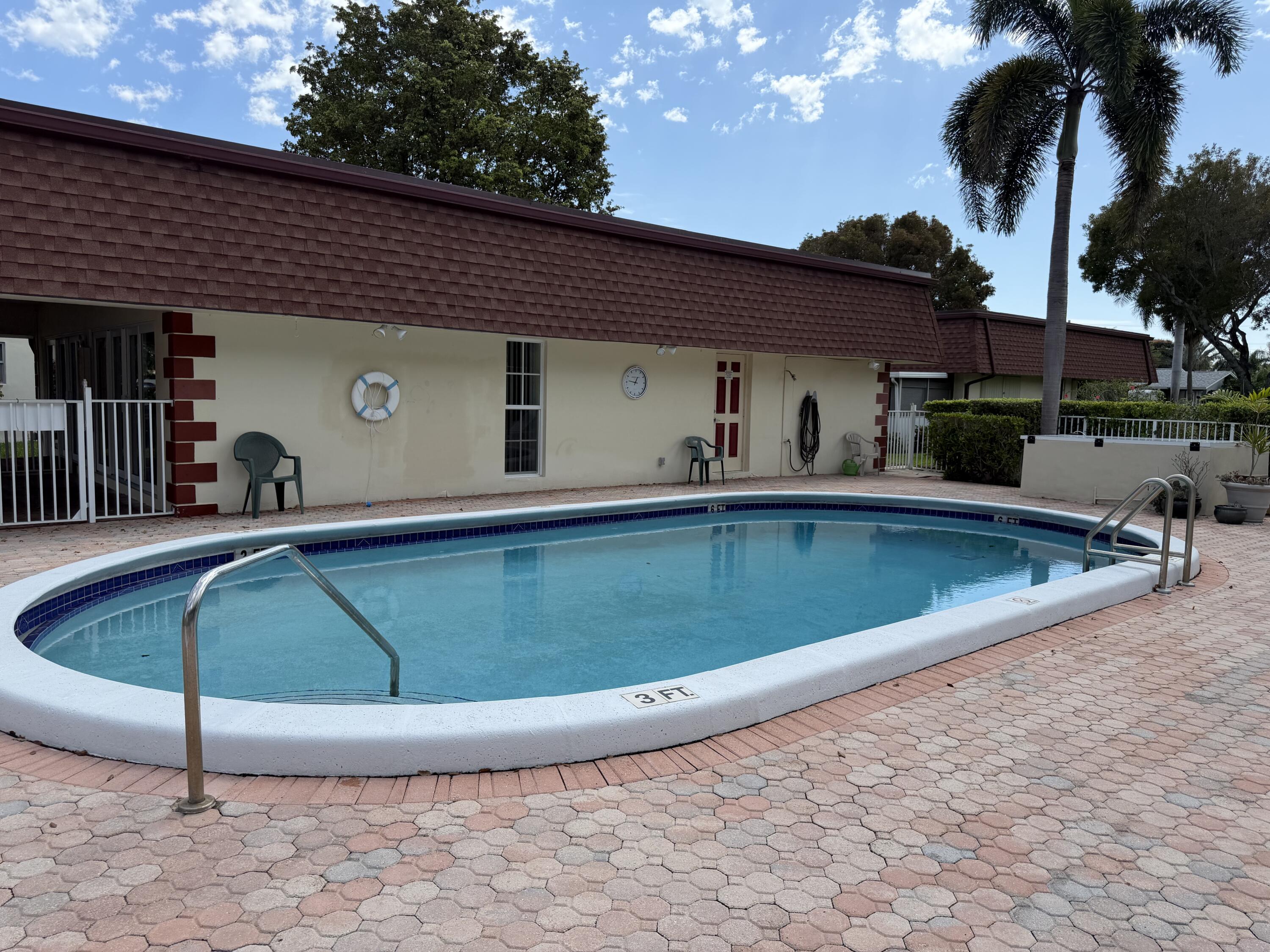 3225 Northeast 21st Avenue, Unit 7 Lighthouse Point, FL 33064 - Photo 23 of 28 a view of a house with swimming pool