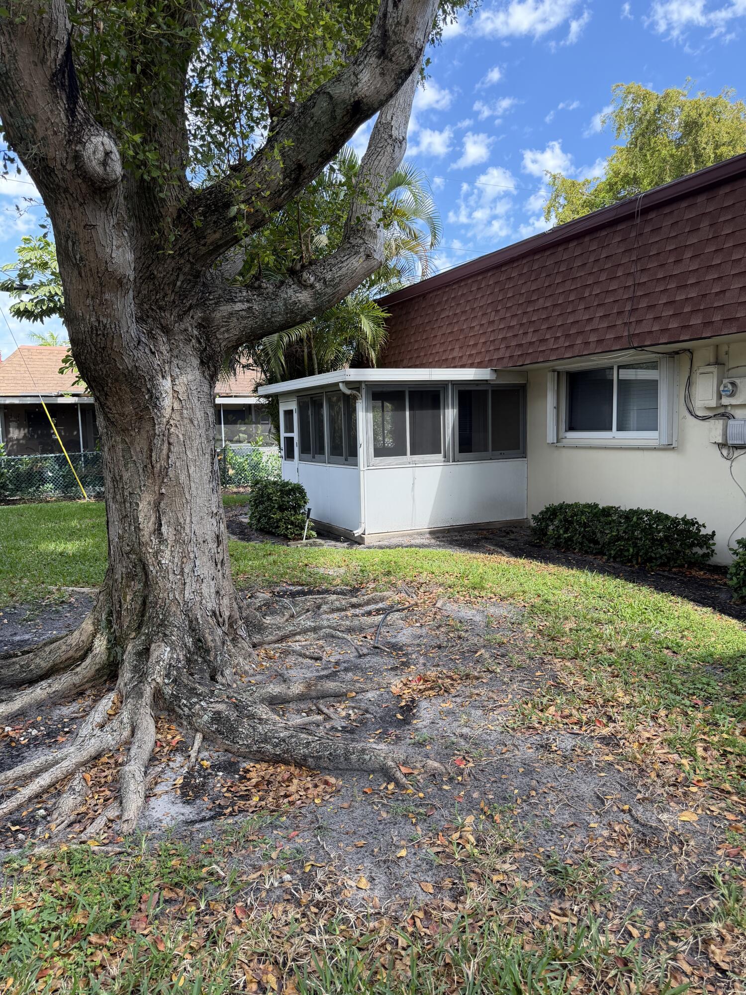 3225 Northeast 21st Avenue, Unit 7 Lighthouse Point, FL 33064 - Photo 4 of 28 a front view of house with yard and green space