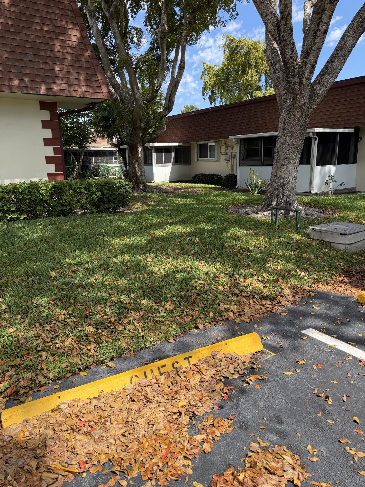 3225 Northeast 21st Avenue, Unit 7 Lighthouse Point, FL 33064 - Photo 5 of 28 a view of a house with a yard