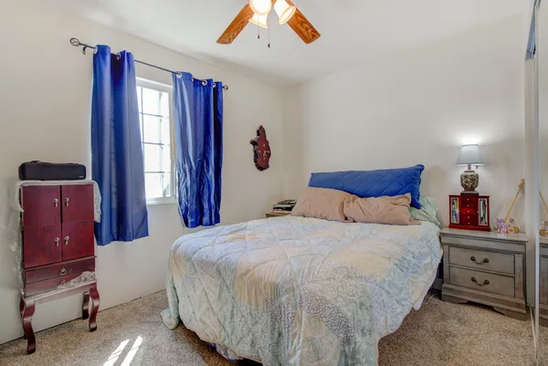 a bedroom with a bed and a closet