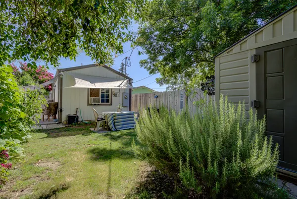 a backyard of a house with seating space