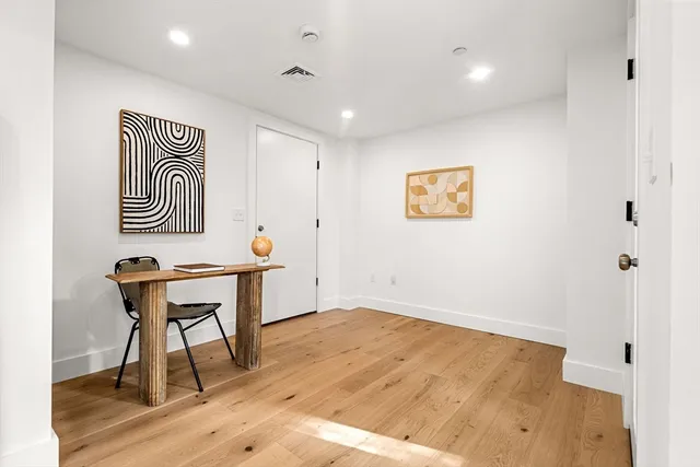 a workspace with furniture and wooden floor