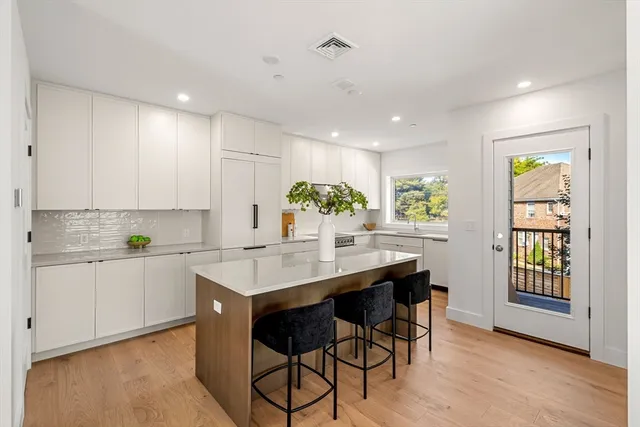 a kitchen with a sink cabinets and window