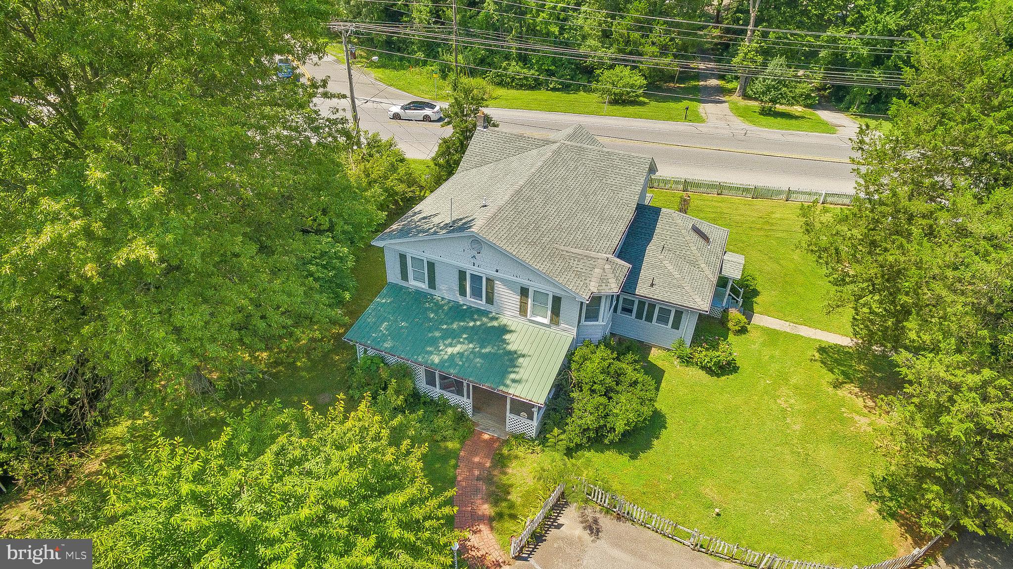 2440 Hallowing Point Road Prince Frederick, MD 20678 - Photo 50 of 51 a aerial view of a house with swimming pool and large trees