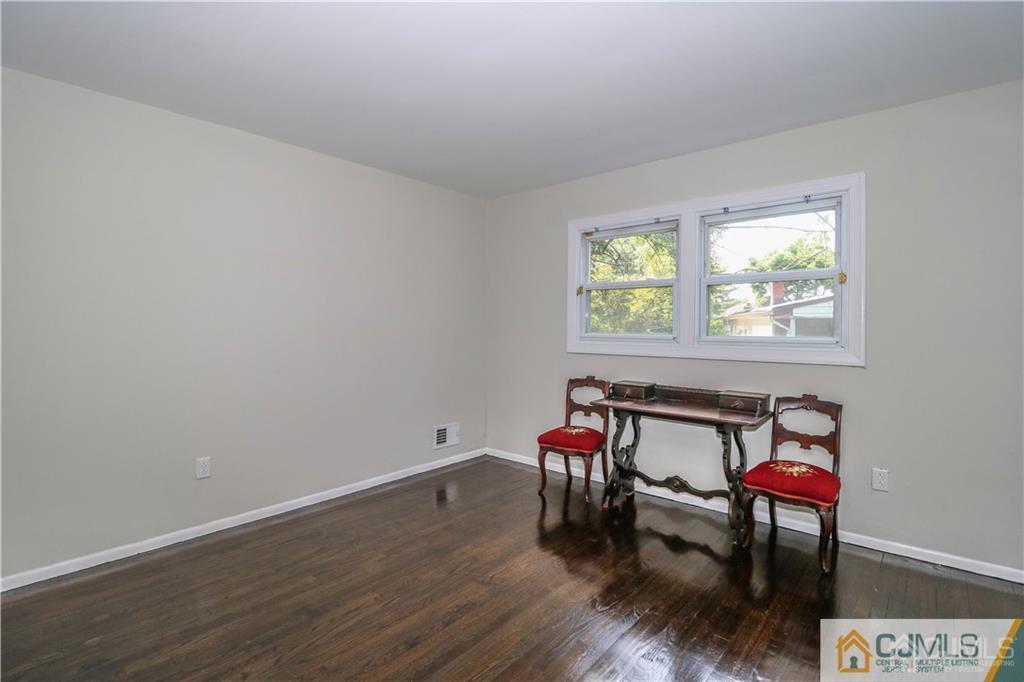39 Wilk Road Edison, NJ 08837 - Photo 13 of 22 a view of a room with wooden floor furniture and windows