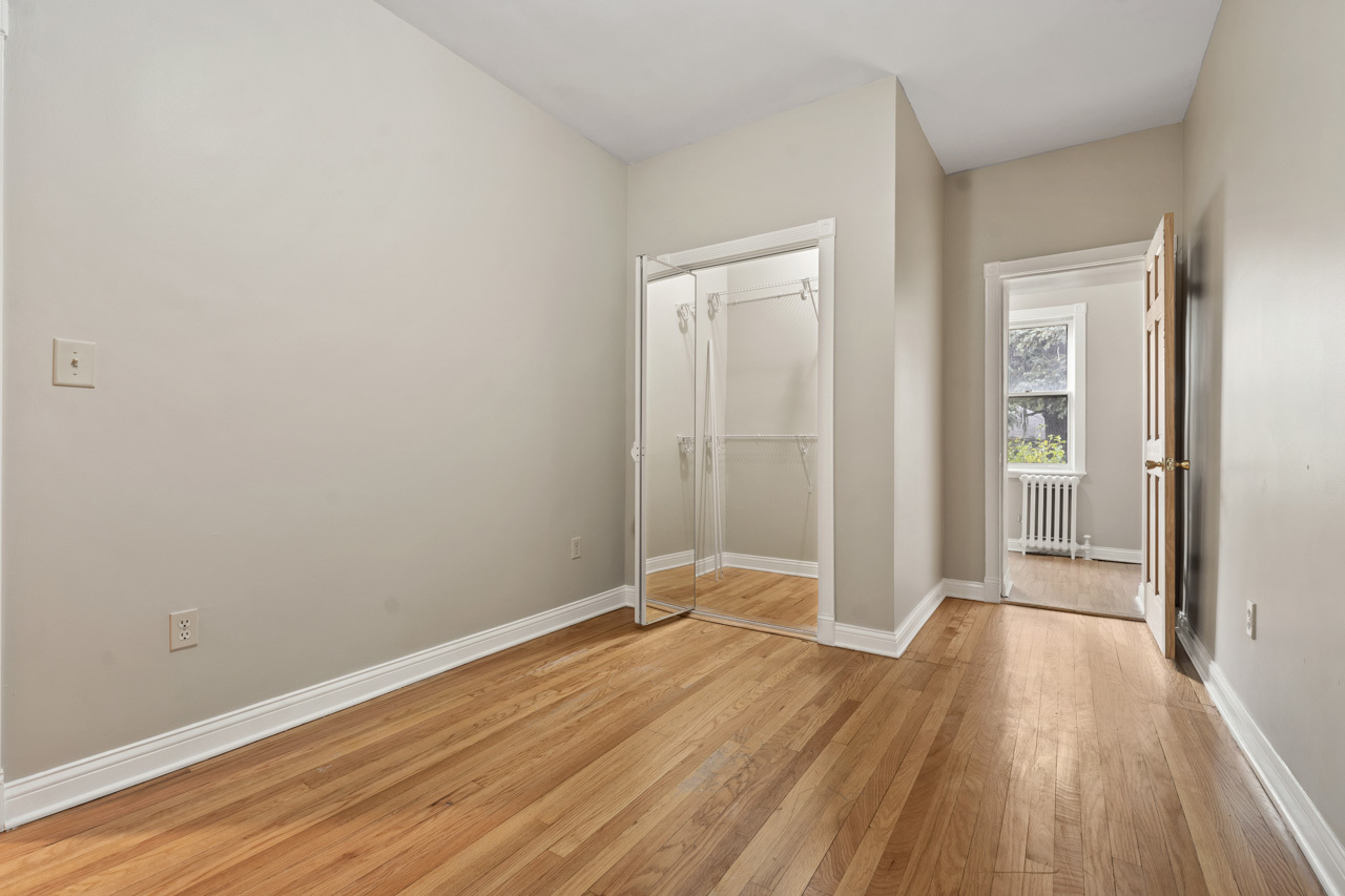 5728 North Maplewood Avenue Chicago, IL 60659 - Photo 17 of 30 wooden floor in a empty room