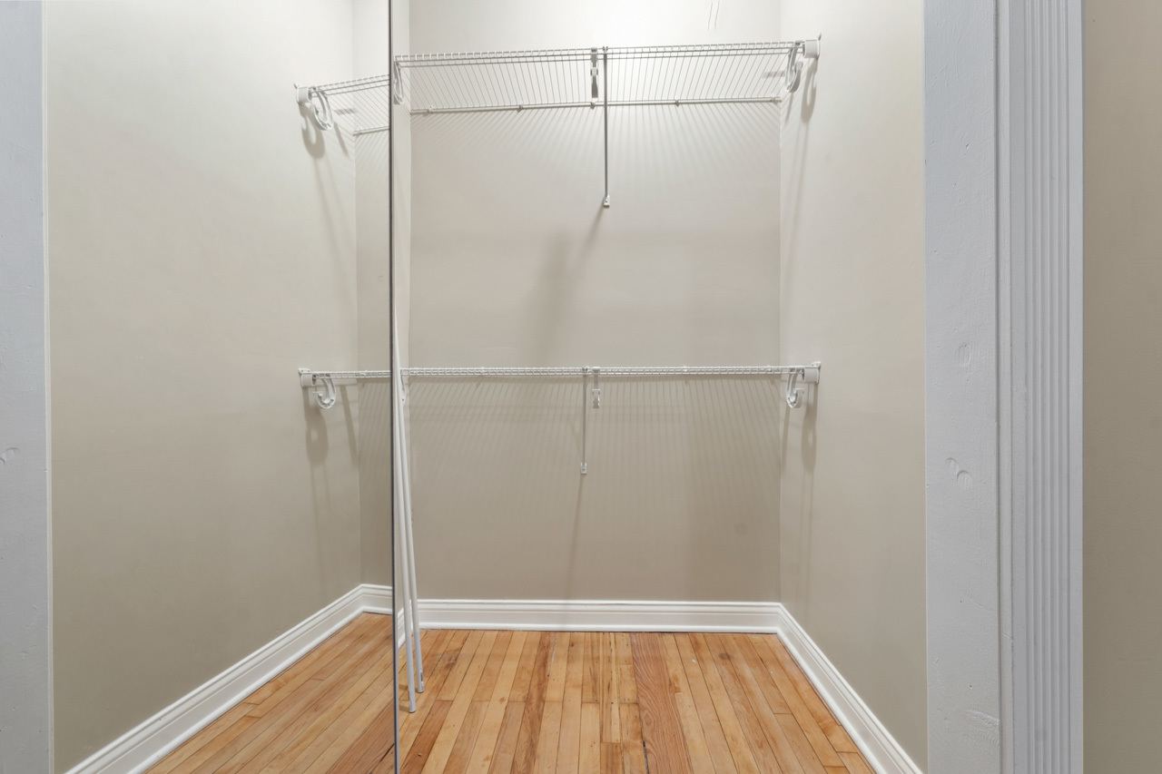 5728 North Maplewood Avenue Chicago, IL 60659 - Photo 18 of 30 a view of a room with wooden floor and fan