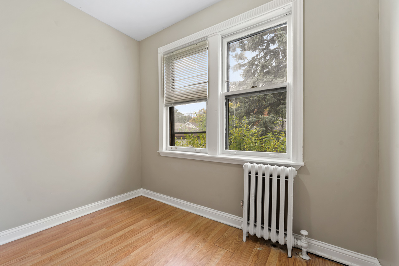 5728 North Maplewood Avenue Chicago, IL 60659 - Photo 21 of 30 an empty room with wooden floor and windows