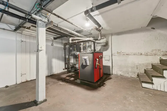 a view of a storage room with water heater and storage