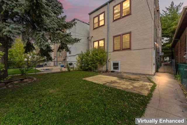 a view of a backyard of the house