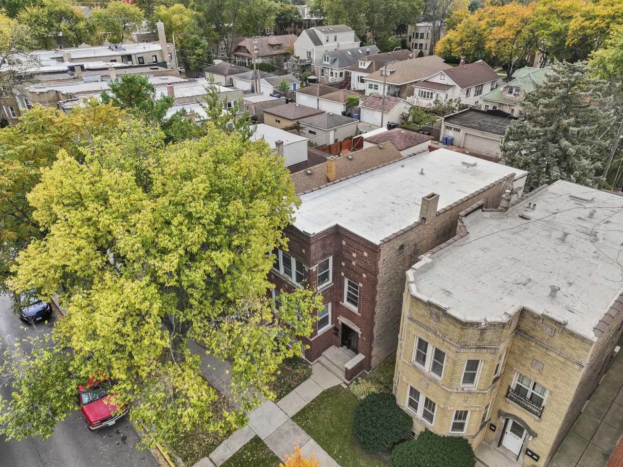 5728 North Maplewood Avenue Chicago, IL 60659 - Photo 27 of 30 an aerial view of residential houses with outdoor space