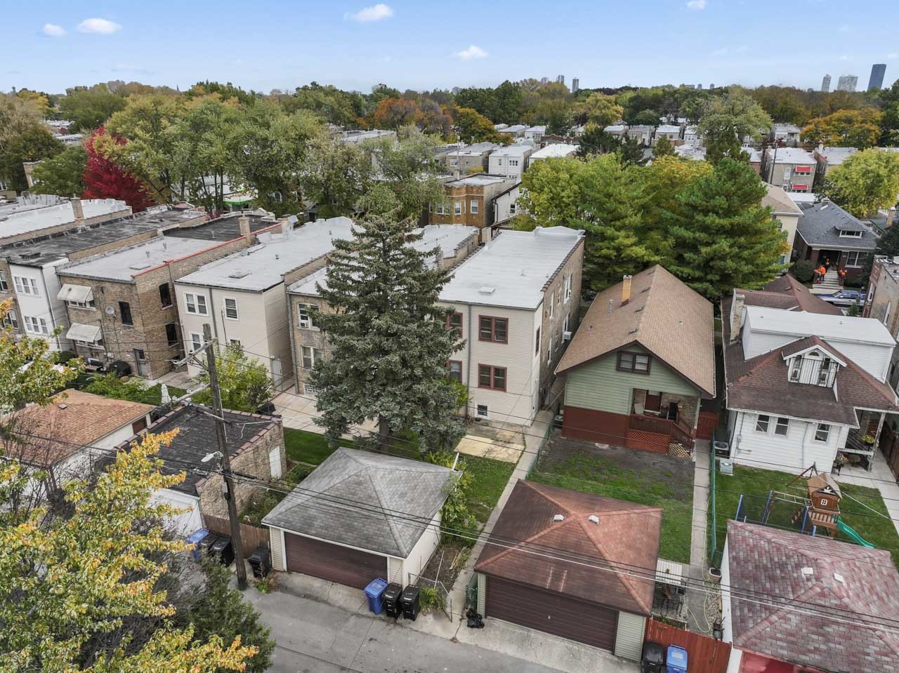 5728 North Maplewood Avenue Chicago, IL 60659 - Photo 28 of 30 an aerial view of multiple houses with a yard