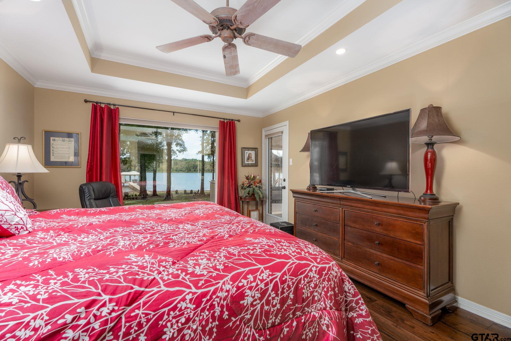 14312 East Ridge Road Arp, TX 75750 - Photo 15 of 44 a bedroom with a bed and a flat screen tv