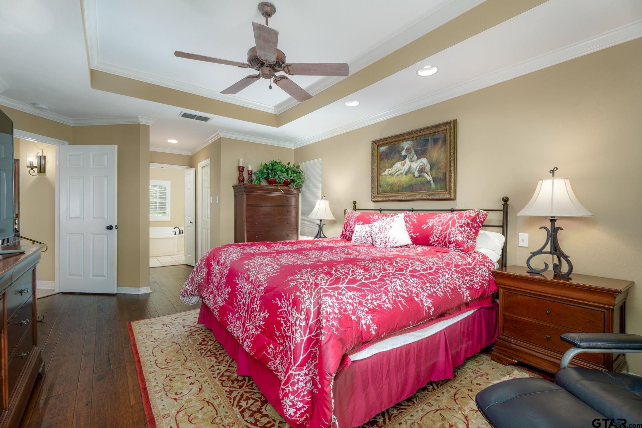 14312 East Ridge Road Arp, TX 75750 - Photo 16 of 44 a bedroom with a bed dresser and wooden floor