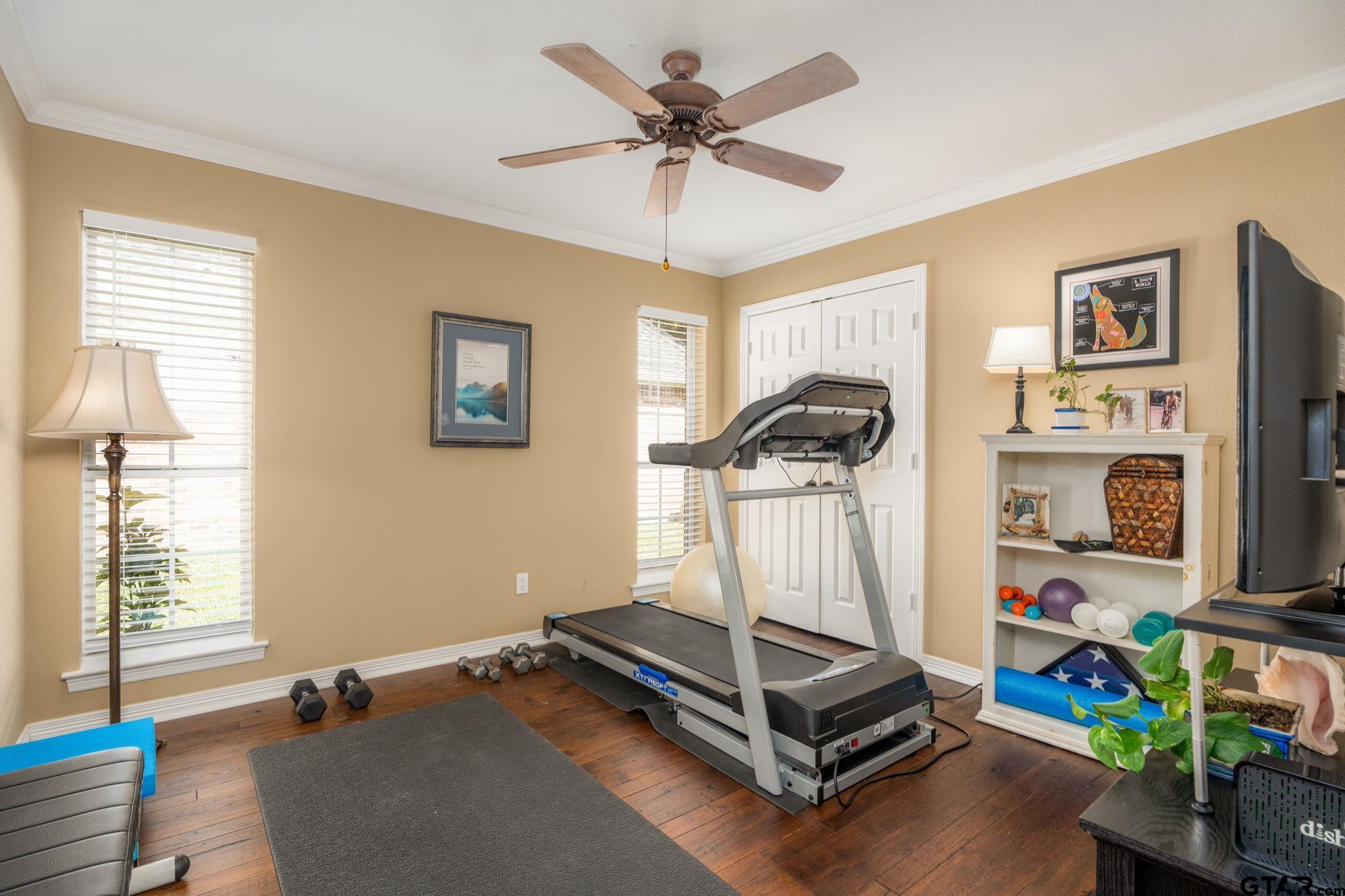 14312 East Ridge Road Arp, TX 75750 - Photo 19 of 44 a room with gym equipment and windows