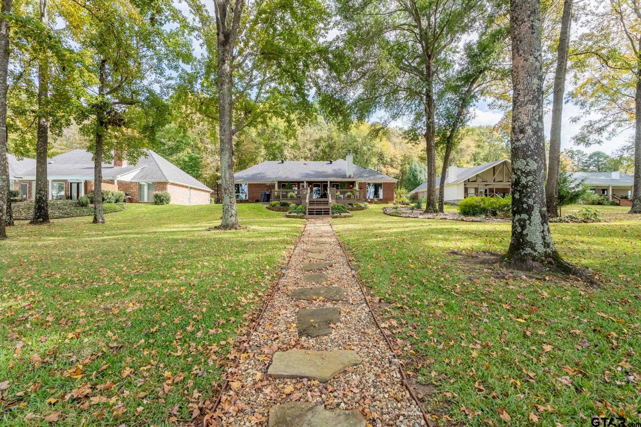 14312 East Ridge Road Arp, TX 75750 - Photo 30 of 44 a view of a yard with plants and trees