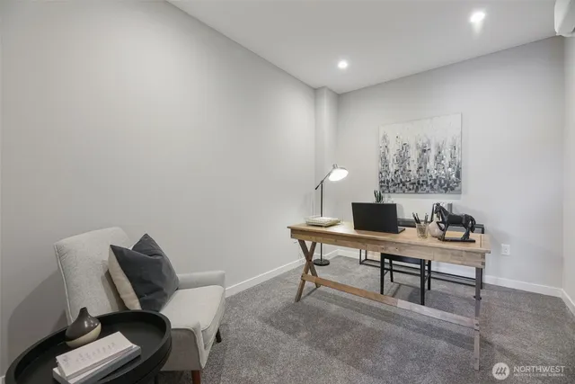 a view of a workspace with furniture