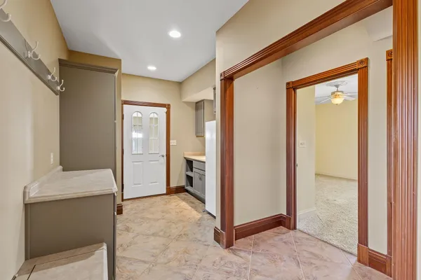 a view of a hallway with closet and entryway