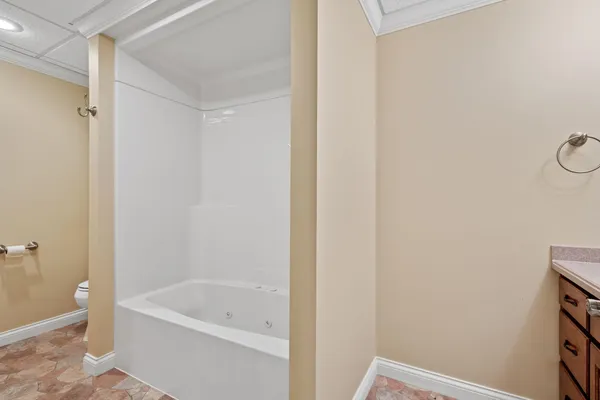 a bathroom with a tub and a shower