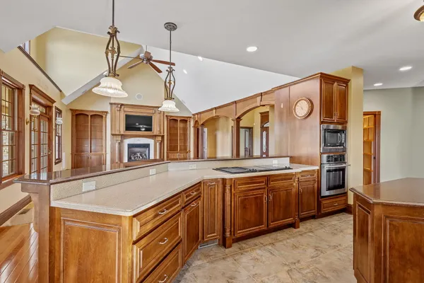 a kitchen that has a lot of cabinets in it