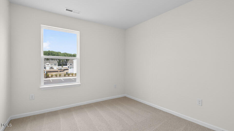 28 Red Clover Drive Angier, NC 27501 - Photo 21 of 41 an empty room with a window