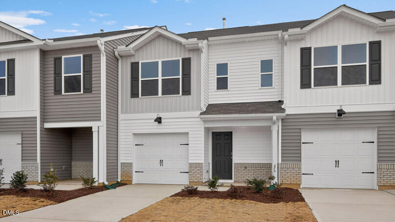 28 Red Clover Drive Angier, NC 27501 - Photo 3 of 41 a front view of a house with a yard