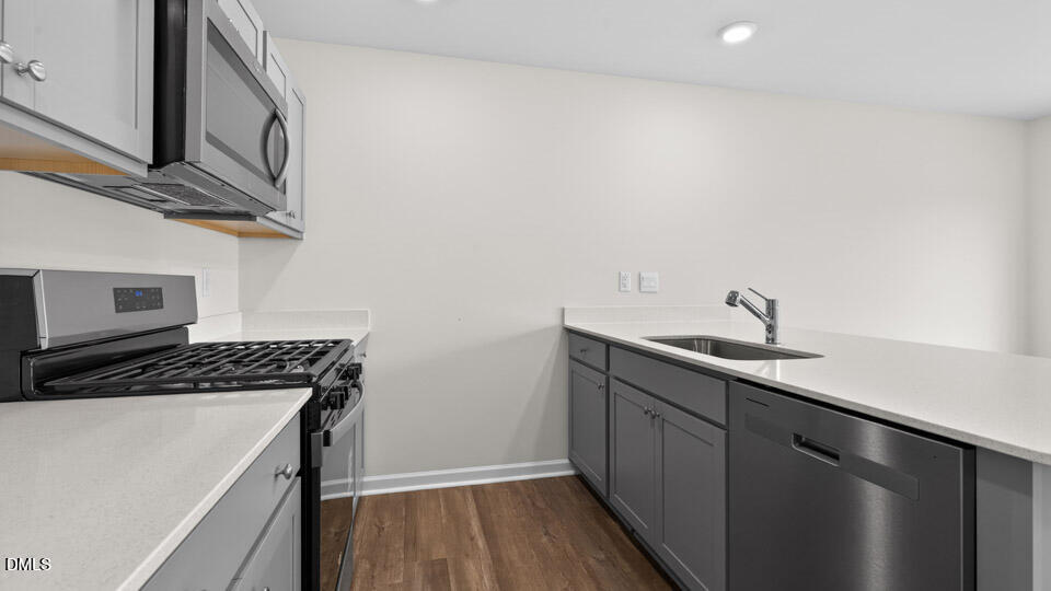 28 Red Clover Drive Angier, NC 27501 - Photo 8 of 41 a kitchen with a sink and cabinets