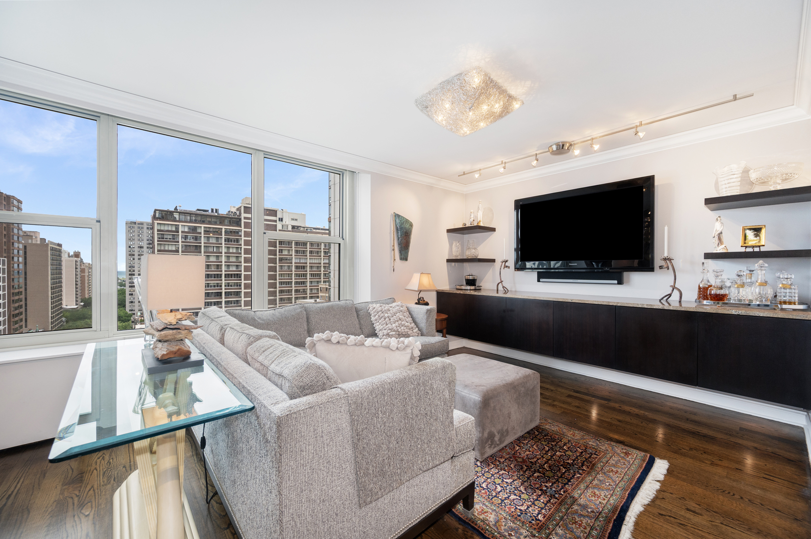 1325 North State Parkway, Unit 16B Chicago, IL 60610 - Photo 14 of 35 a living room with furniture and a flat screen tv