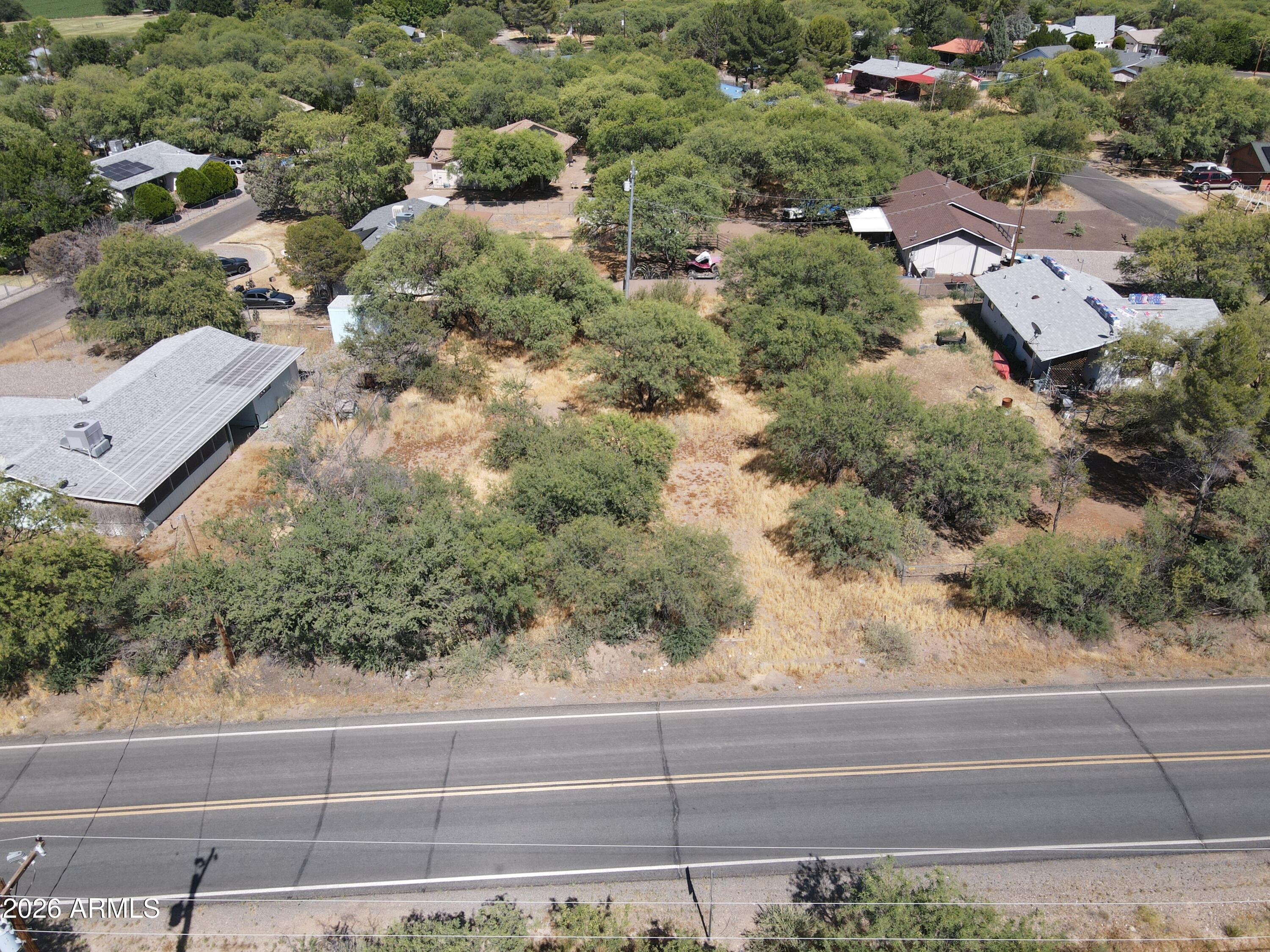 3665 South Salt Mine Road, Unit 27 Camp Verde, AZ 86322 - Photo 5 of 15 an aerial view of a house with yard and outdoor seating
