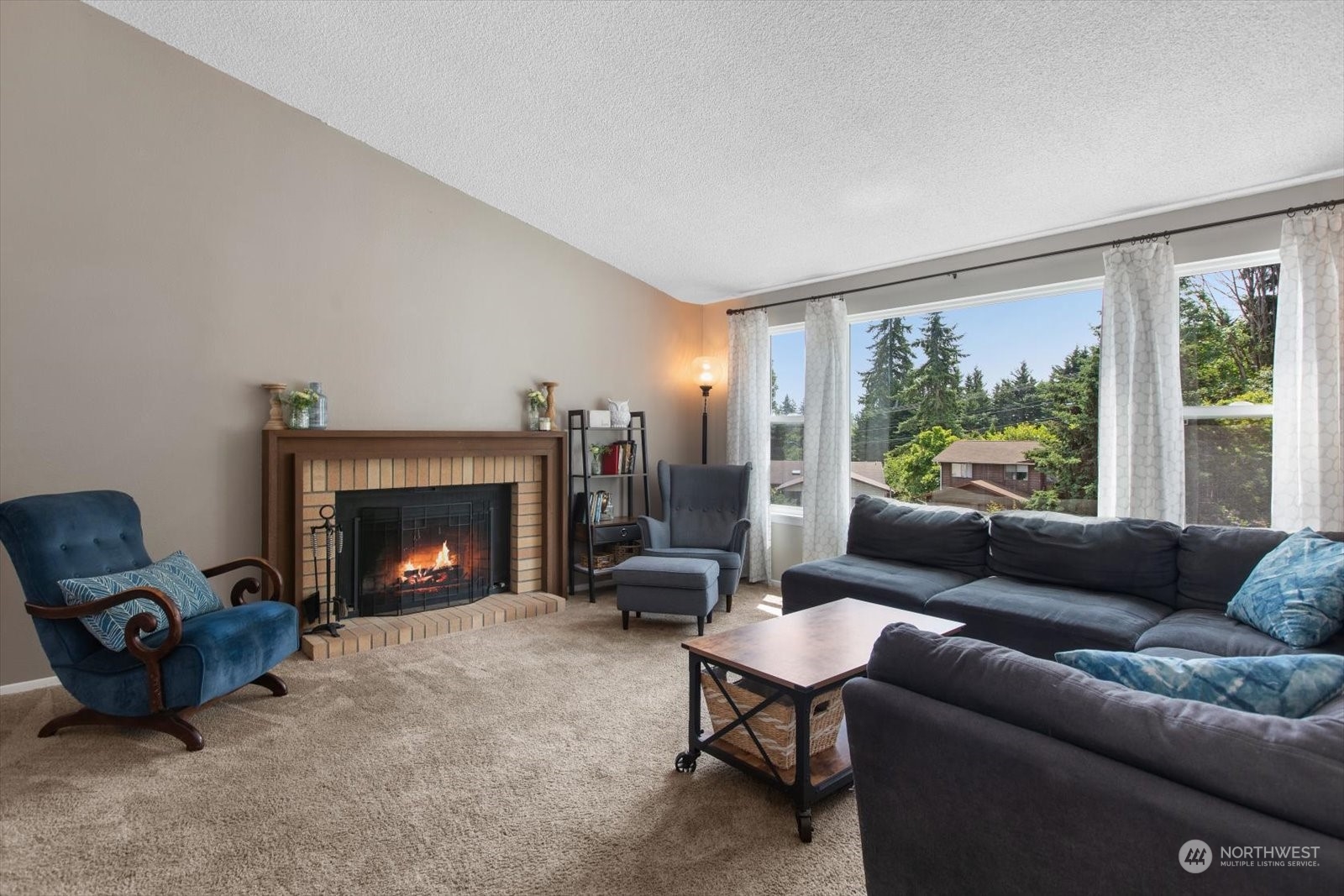 331 163rd Place Southeast Bothell, WA 98012 - Photo 3 of 36 a living room with furniture and a fireplace