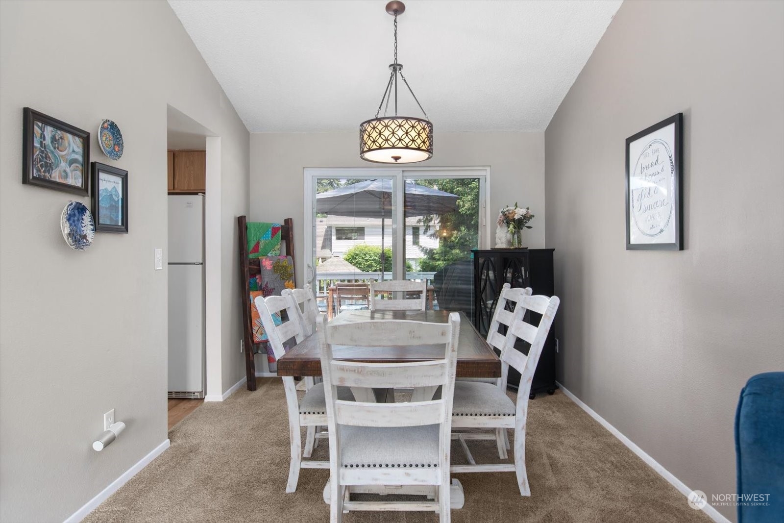 331 163rd Place Southeast Bothell, WA 98012 - Photo 7 of 36 a dining room with furniture a chandelier and window