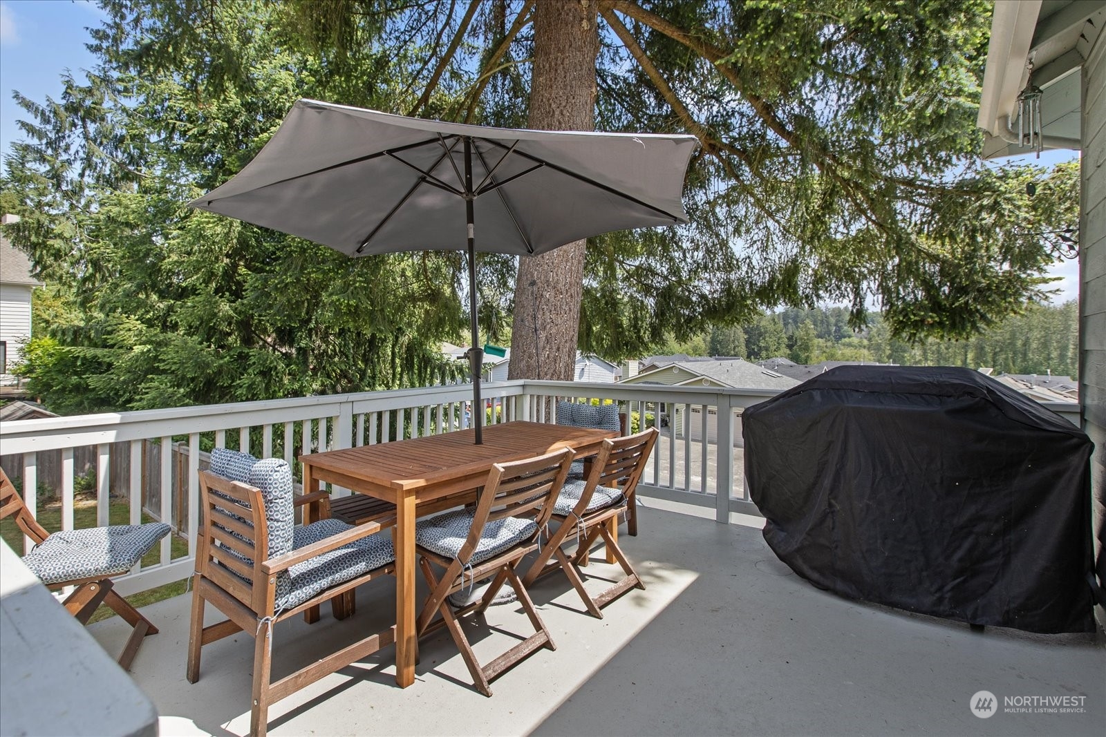 331 163rd Place Southeast Bothell, WA 98012 - Photo 8 of 36 a view of a chairs and table under an umbrella